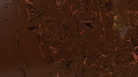 Ambra Scura engineered marble: deep chocolate brown with swirling copper-orange and black veins