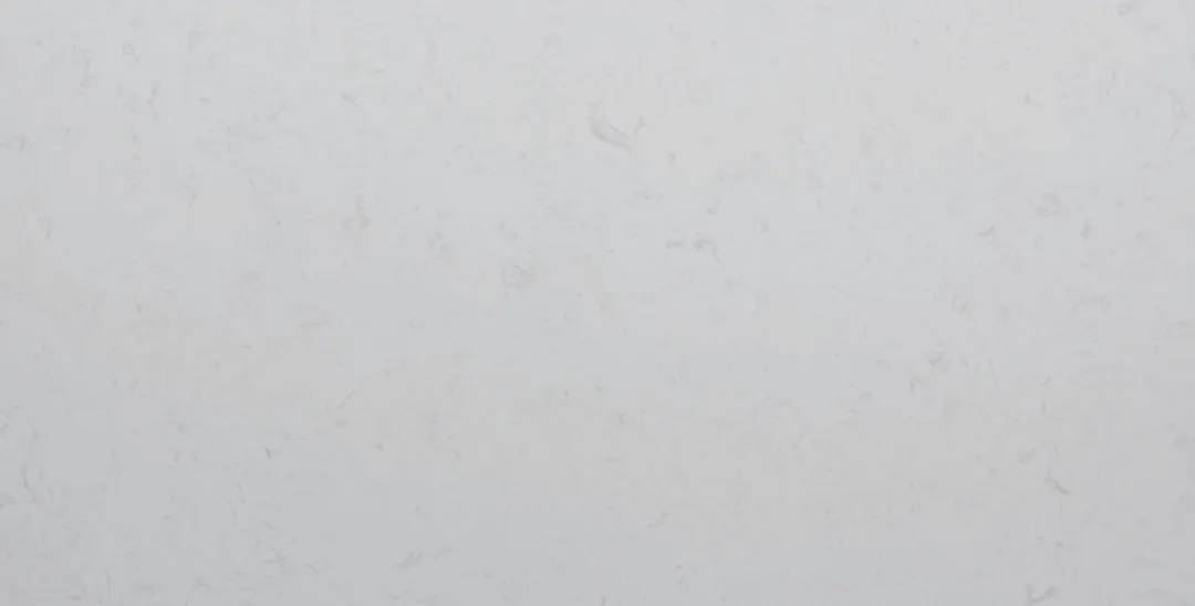 Bianco Gesso engineered marble slab: near-solid soft white with the faintest veining
