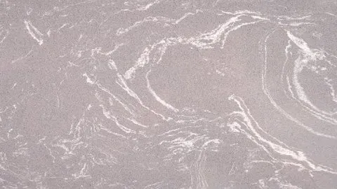 Fumo Venato engineered marble: smoky mauve-grey ground with flowing white wave-like veins