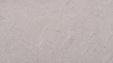Grigio Sabbia engineered marble: pale sandy grey with low-contrast rippling swirls