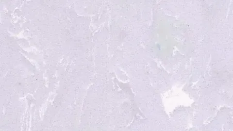Lilla engineered marble: palest lilac ground with crisp white flashes and broken white veins