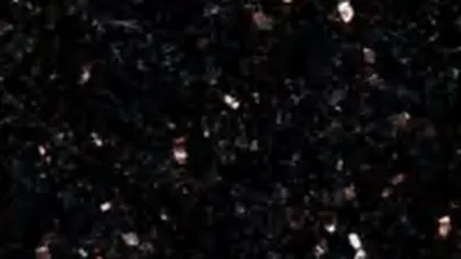 Black Galaxy granite slab: bronze and gold flecks on a black ground