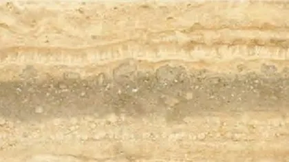 Blue Travertine slab: cream and honey layers crossed by a broad blue-grey band
