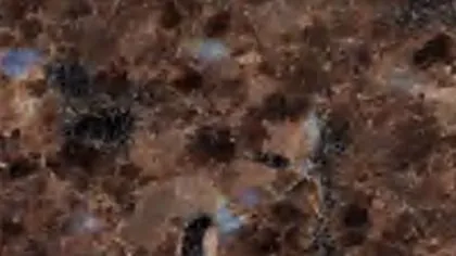 Labrador Antique granite slab: chestnut brown crystals with pale blue iridescent flecks