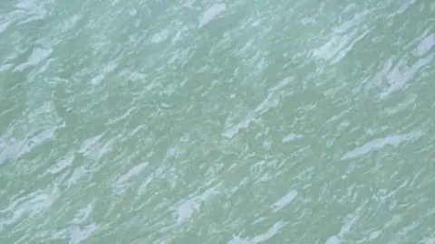 Acqua quartz slab: seafoam green with short white diagonal ripples
