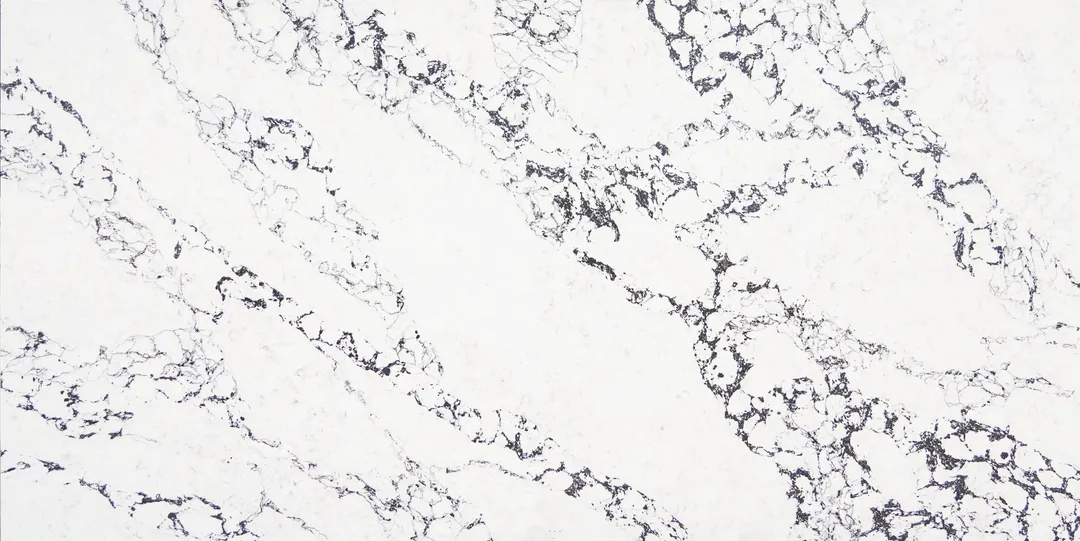Arabescato Nero quartz slab: dense black lace veins gathered in diagonal bands on white