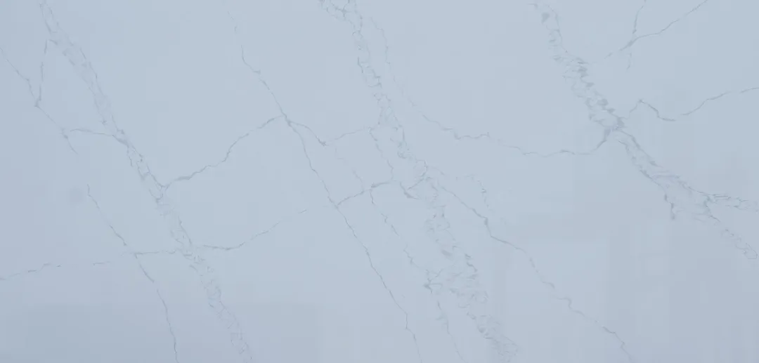 Bianco Ghiaccio quartz slab: cool white with faint, whisper-light grey veins