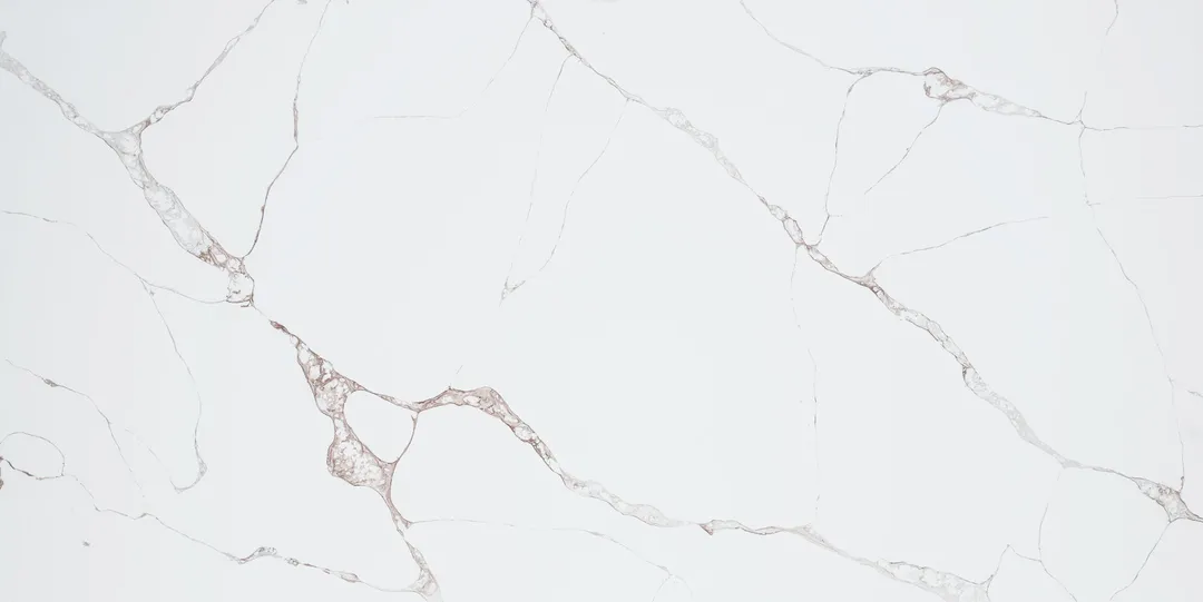 Calacatta Bronzo quartz slab: fine grey and soft bronze veins on white