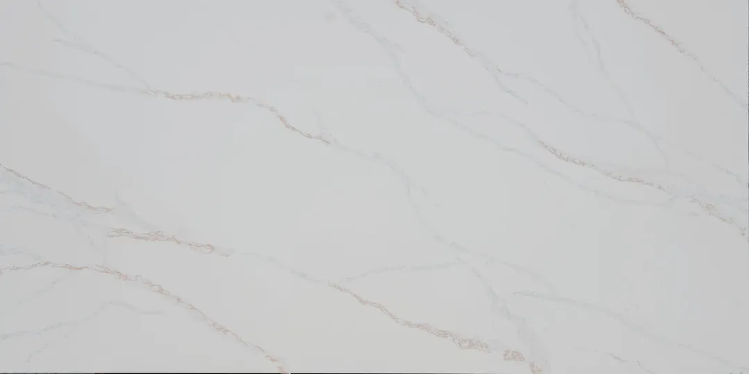 Calacatta Infinito quartz slab: long, unbroken grey and taupe veins running diagonally on white