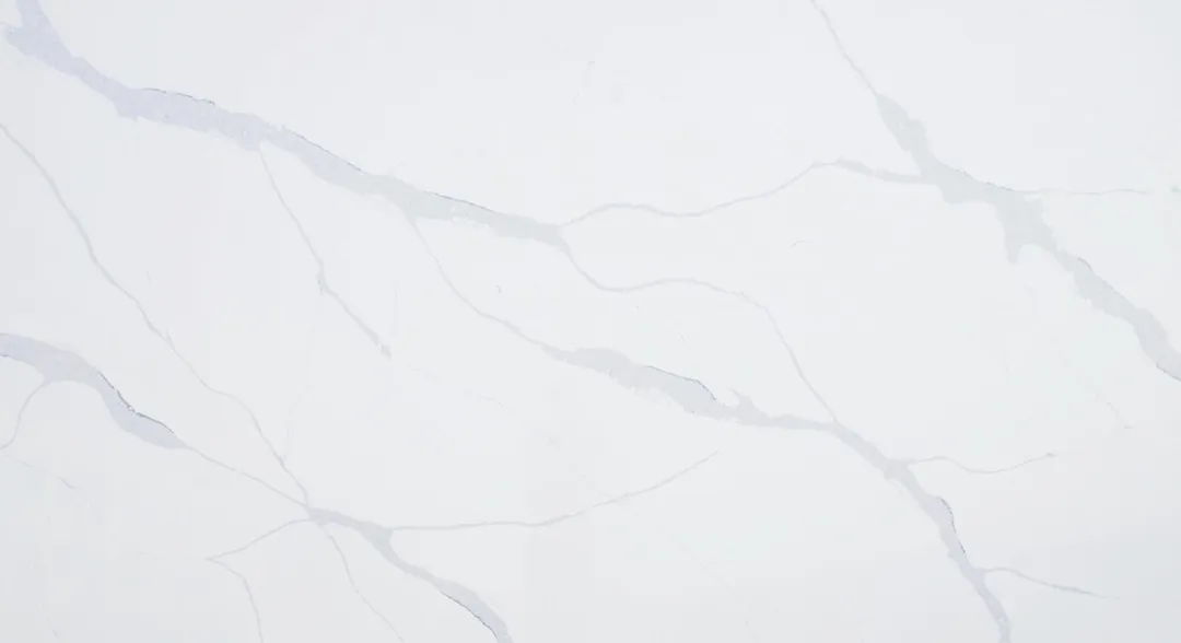 Calacatta Lieve quartz slab: faint, widely spaced grey veins on white