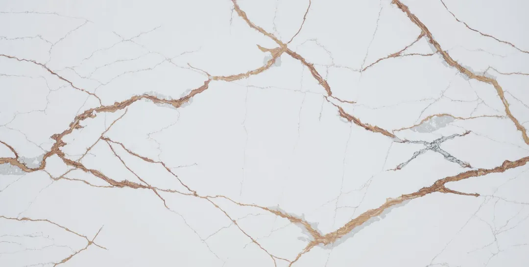 Calacatta Rame quartz slab: bold copper-brown veins crossing white