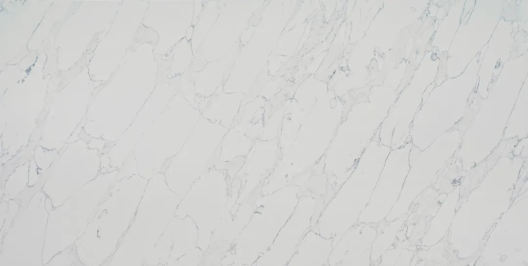 Carrara Fino quartz slab: crisp, fine grey veins on white in a Carrara pattern