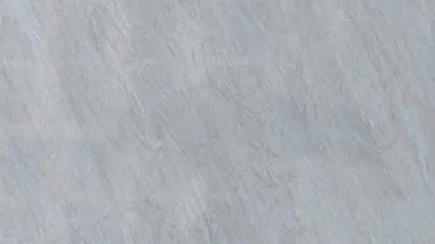 Cielo quartz slab: silvery grey with fine combed diagonal streaks