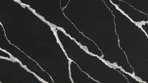 Nero Calacatta quartz slab: broad grey-white veins with frayed edges streaming over black