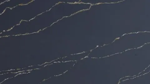 Notte Oro quartz slab: thin broken gold veins in loose parallels on midnight navy