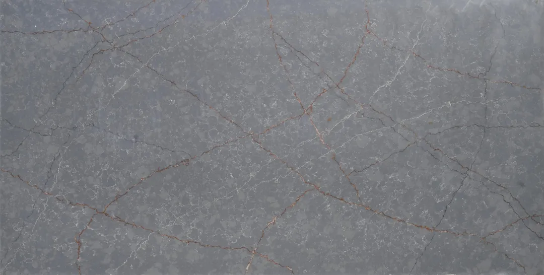 Pietra Grigia quartz slab: fine white and copper veins on a mid-grey ground
