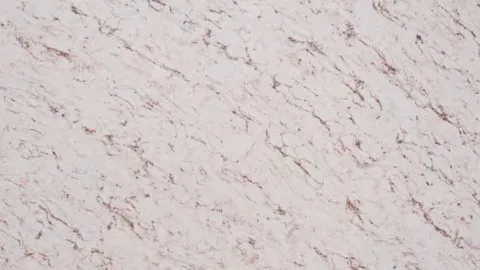 Rosa Venato quartz slab: short rust-red diagonal threads on blush pink