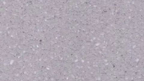 Colomba terrazzo: cool lilac-grey ground densely dusted with fine white chips