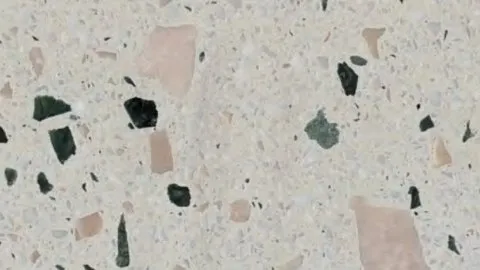 Coriandoli terrazzo: cream ground with large blush-pink and deep green chips