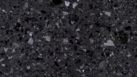 Lavagna terrazzo: slate black ground with angular white and pale grey chips