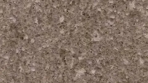 Nocciola terrazzo: hazelnut brown ground densely packed with small beige and dark brown chips