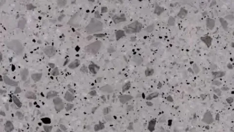 Pepe terrazzo: light grey ground with mid-grey chips and small black flecks