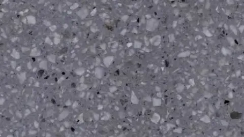 Piombo terrazzo: dark blue-grey ground packed with white and pale grey chips